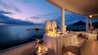 Balcony ocean night candles plates - a view of the ocean free wallpaper
