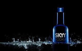 Sky vodka splashing water bottle - product photography free wallpaper