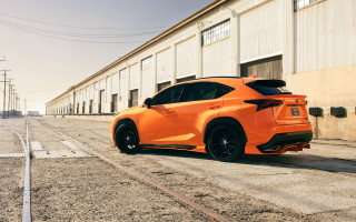 Bright orange sports car street - side profile free wallpaper
