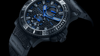 Black clock blue second hand - a black strap free wallpaper