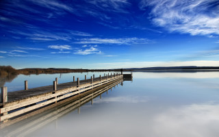Lake dock clouds mountains sky - a body of water below free wallpaper