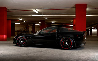 Black sports car red pillars - a parking garage free wallpaper for desktop