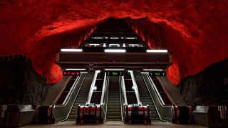 Subway escalators red walls tunnel - intimidating free wallpaper