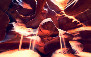 Narrow slot waterfall rock firelight - side and a light free wallpaper