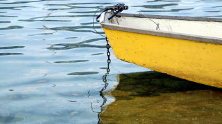 Yellow boat chain beach scenery - a chain free wallpaper