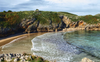 Beach cliff water boat mountain - photoreal free wallpaper