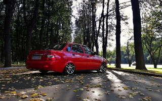 Red car parked road autumn - a red car free wallpaper