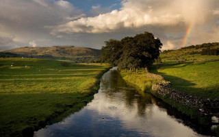 River green field rainbow cloudy - a lush green field under a cloudy sky free wallpaper