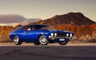Blue muscle car mountain sunset 2 - photoreal free wallpaper