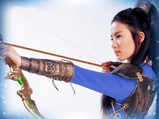 Blue dress archer posing chen - a blue sky behind her free wallpaper