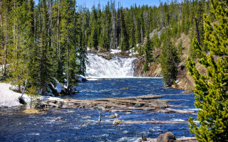 River waterfall trees snow rocks - a waterfall in the background and trees free wallpaper