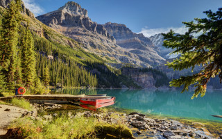 Rocky shore mountain lake boat - bob ross free wallpaper
