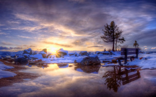 Sunset snowy landscape bench trees - the foreground and a body of water free wallpaper