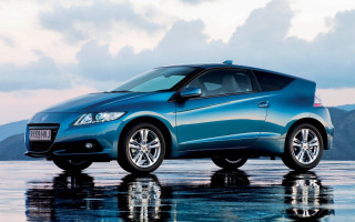 Blue car mountains clouds wet - a wet surface free wallpaper for desktop
