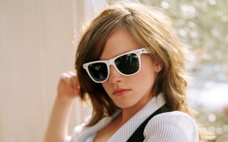 Woman sunglasses white shirt posing - her arm behind her head free wallpaper