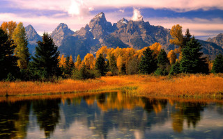 Mountain lake forest autumn sunset 6 - a lake in the foreground and trees free wallpaper