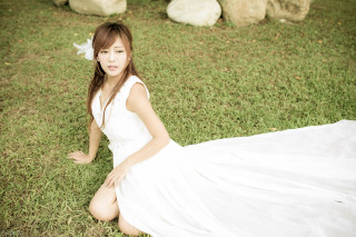 Woman white dress sitting grass - sheep free wallpaper