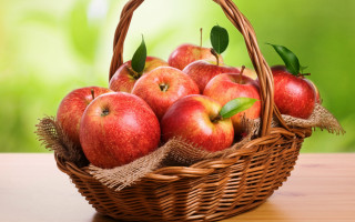 Basket apples green leafy background - a green leafy area free wallpaper