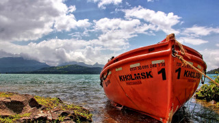 Red boat lake mountain sky - a red boat free wallpaper
