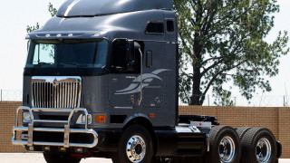 Semi truck parking lot tree - anson maddock free wallpaper