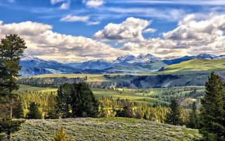 Mountain range trees clouds sky 5 - a scenic view of a mountain range free wallpaper