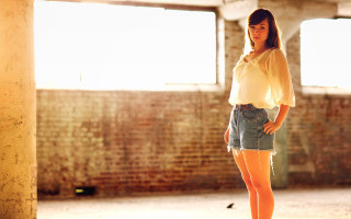 Woman skateboard brick wall sunset - claire hummel free wallpaper