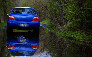 Blue car parked reflections forest - reflection free wallpaper for desktop