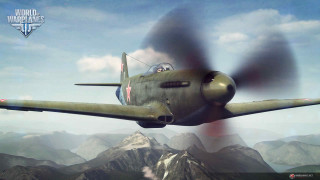 Green airplane flying mountain range 3 - a propeller free wallpaper