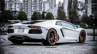 White sports car urban scene - tall building free wallpaper