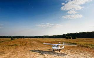 Small plane dirt road field - sky free wallpaper