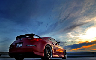 Red sports car cloudy sky 21 - the sun setting free wallpaper