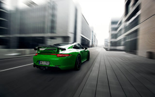 Green sports car city street 2 - a green sports car free wallpaper