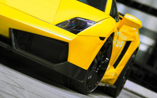 Yellow sports car street clock - a yellow sports car free wallpaper