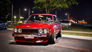 Red car night city street 2 - the side of a road free wallpaper