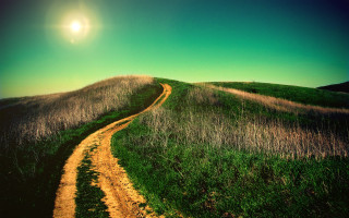 Dirt road grassy hill sunlight - a trail free wallpaper