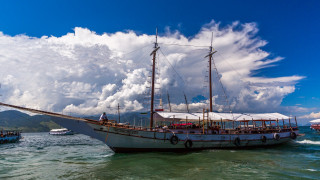 Boat water mountains cloudy sky - the water under a cloudy sky free wallpaper