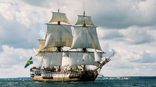 Sailboat ocean cloudy sky flag - free ship wallpaper