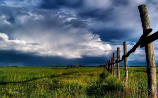 Wooden fence stormy sky city - free sky wallpaper