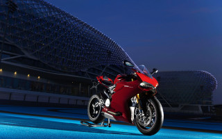 Red motorcycle night city skyline - a red motorcycle free wallpaper