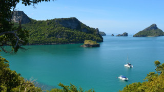 Boats lake forest hillside scenery - a couple of boats free wallpaper