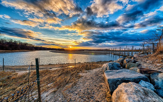 Sunset water shore rocks fence - hdr free wallpaper