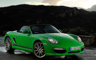 Green sports car mountain sunset - a green sports car free wallpaper