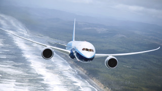 Large jetliner over hills and - turnaround free wallpaper