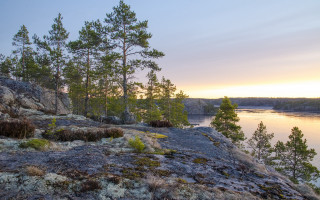 Rocky cliff lake sunset trees - akseli gallenkallela free wallpaper for desktop