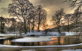 River snow covered trees sunset - a sunset in the background free wallpaper for desktop
