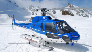 Helicopter snowy mountain ski lift - side and a person free wallpaper