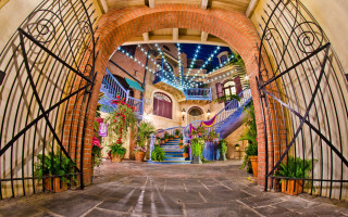 Large archway staircase potted plants - side of it free wallpaper