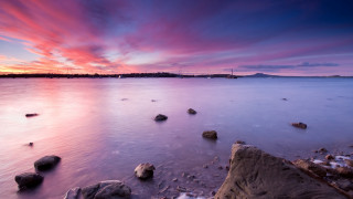 Sunset ocean rocks distant island - calm free wallpaper for desktop