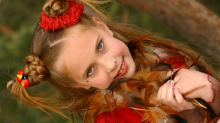 Young girl red flower smile - a pony tail free wallpaper