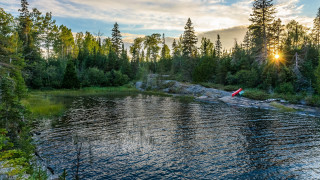 Lake forest sky mountains water - a canoe free wallpaper